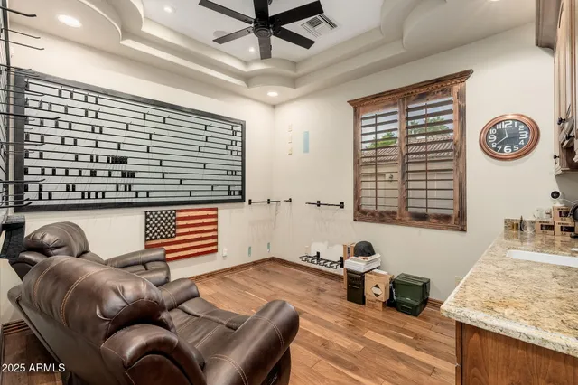 a kitchen with stainless steel appliances granite countertop a kitchen island a stove and a sink