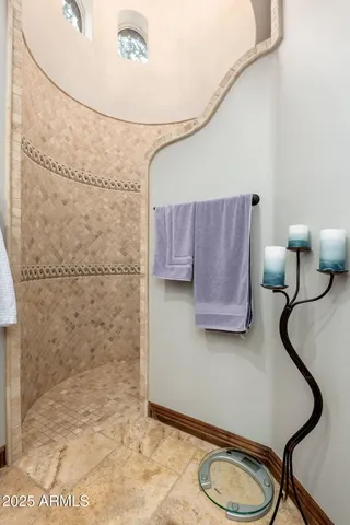 a dining room with furniture a chandelier and wooden floor