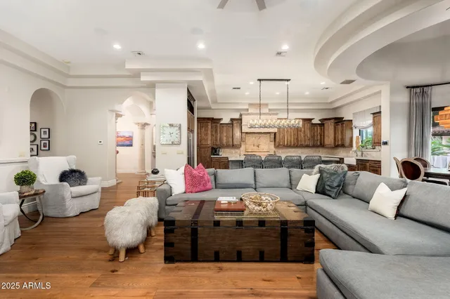 a bathroom with a granite countertop sink a mirror and shower