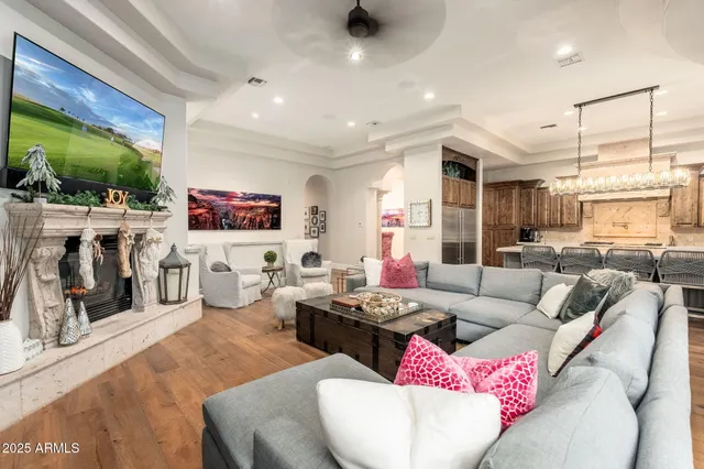 a living room with furniture and a fireplace