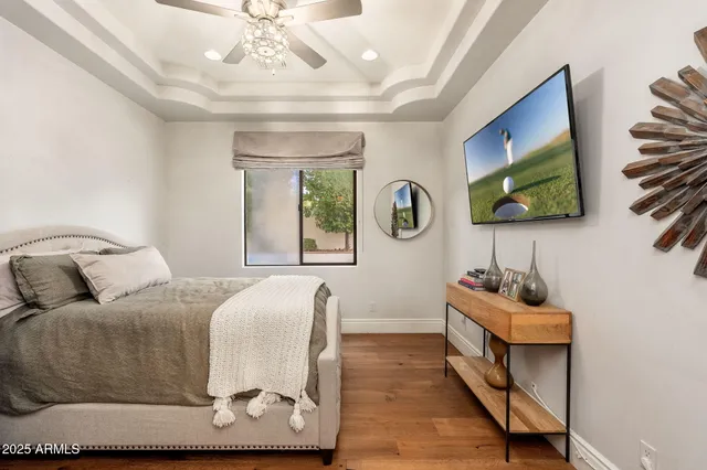 a bed room with a bed couch and dresser