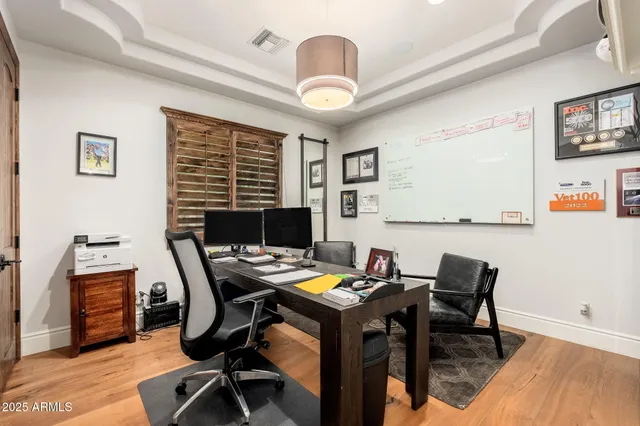 a bathroom with a granite countertop sink toilet a mirror a vanity and shower