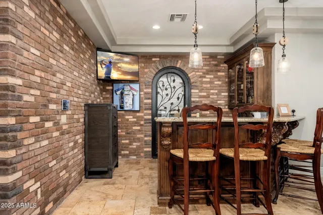 a view of a swimming pool with sitting area