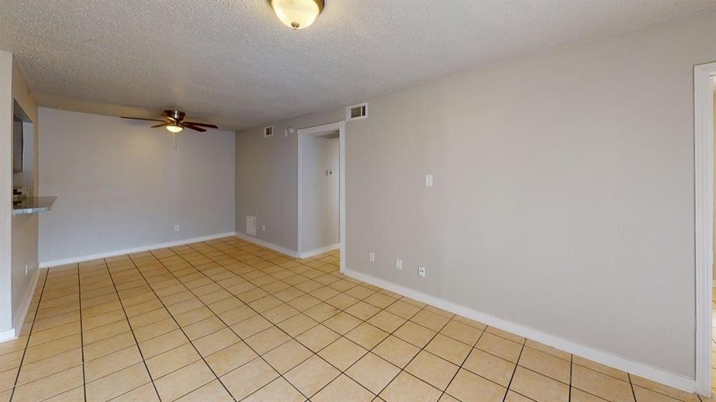 8110 Skillman Street, Unit 1046 Dallas, TX 75231 - Photo 4 of 10 a view of a room with a mirror and a shower