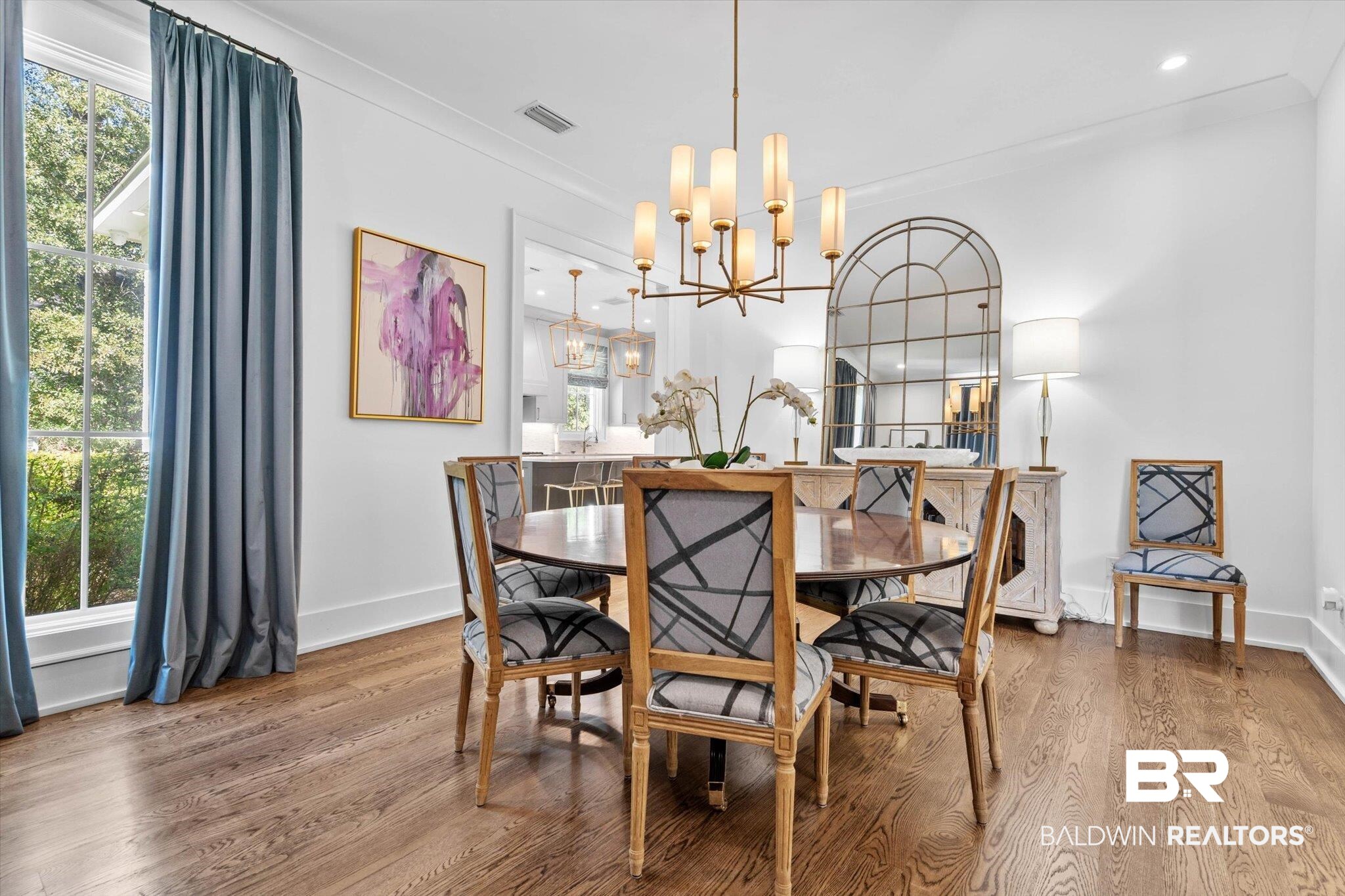 4602 Kingswood Drive Mobile, AL 36608 - Photo 4 of 45 Dining area featuring wood finished floors, a chandelier, and crown molding