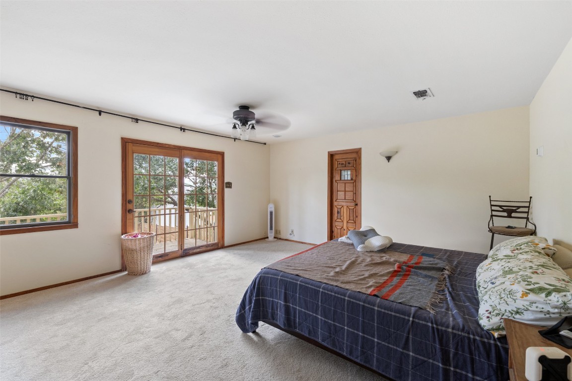 5731 Pool Canyon Cove Austin, TX 78734 - Photo 15 of 17 a bedroom with a large bed and a window