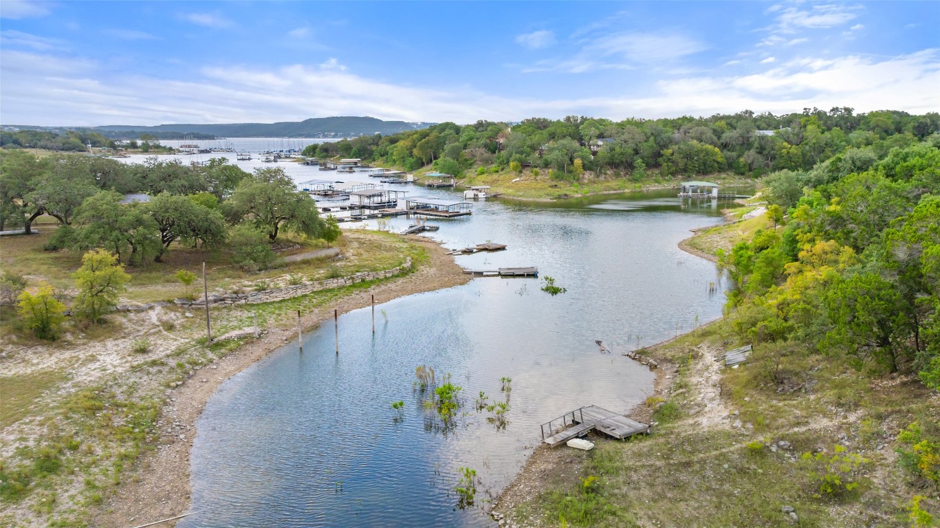5731 Pool Canyon Cove Austin, TX 78734 - Photo 3 of 17 a view of a lake with a mountain in the background