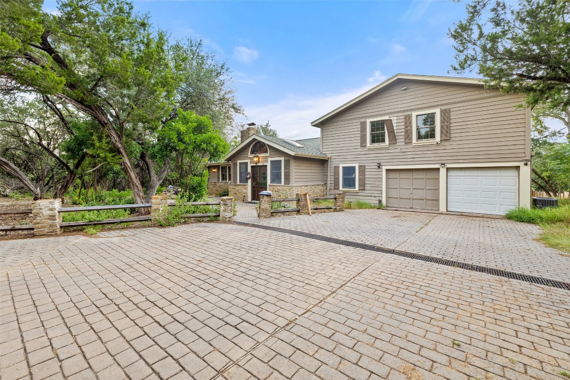 5731 Pool Canyon Cove Austin, TX 78734 - Photo 6 of 17 a front view of a house with a yard