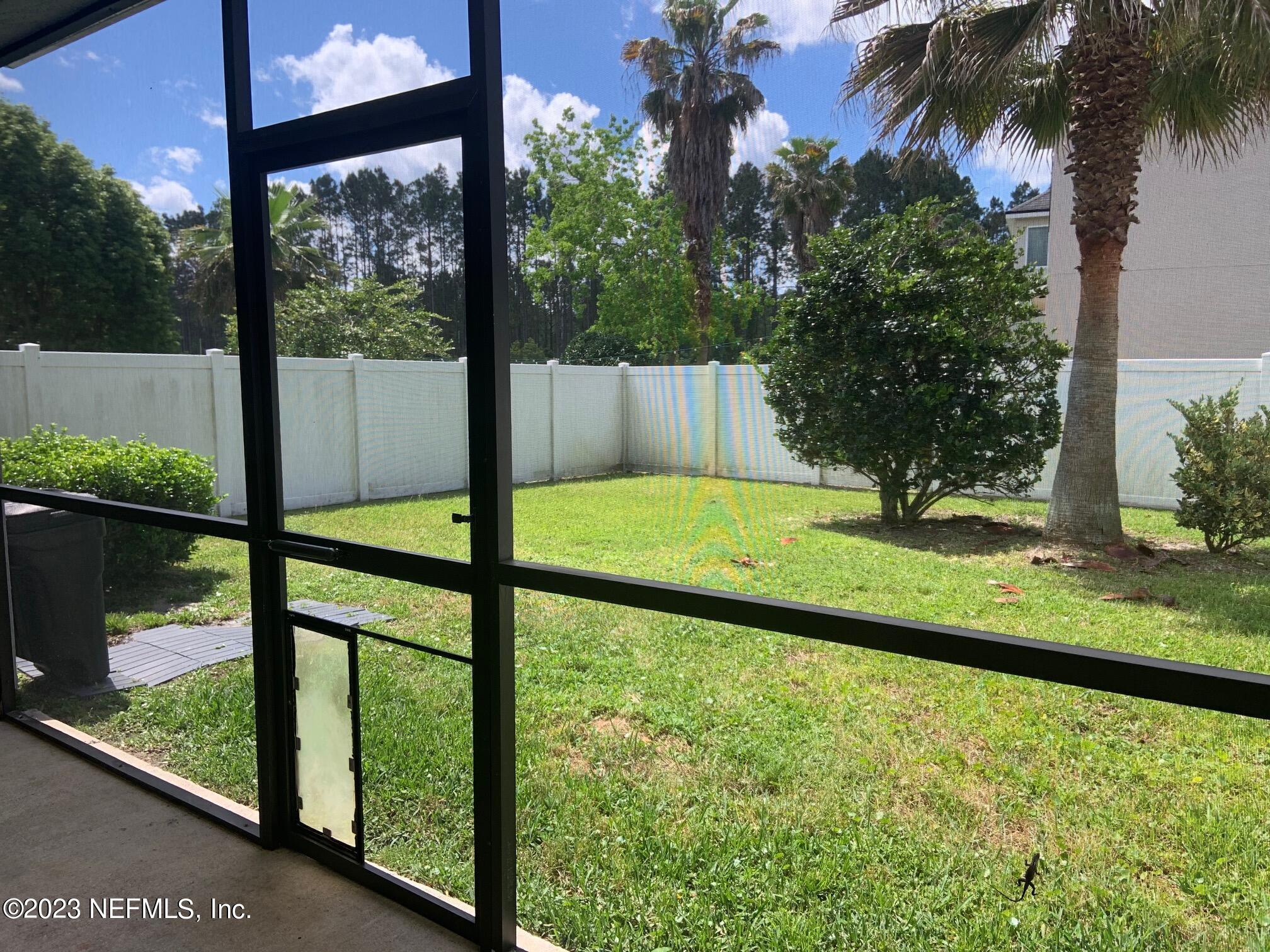 3863 Chasing Falls Road Orange Park, FL 32065 - Photo 16 of 32 a view of a backyard with a lake view