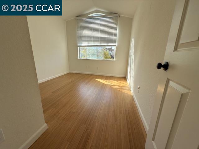 528 Dohrmann Lane Pinole, CA 94564 - Photo 11 of 16 a view of an empty room with wooden floor and a window