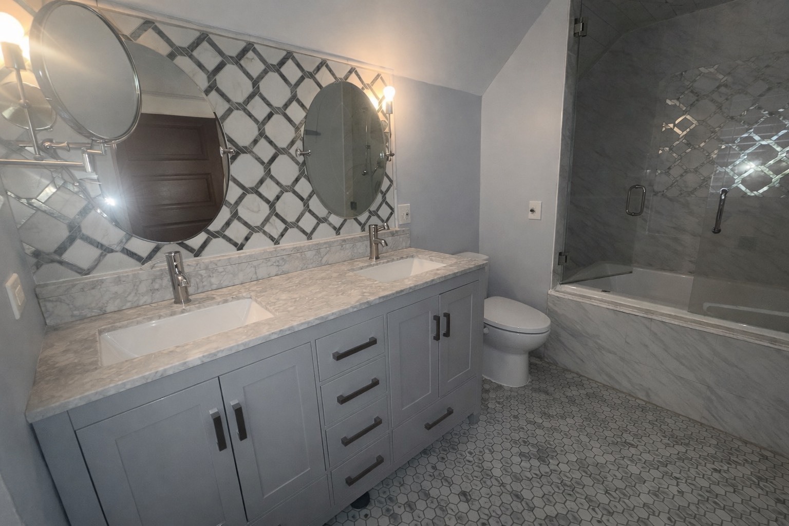 603 Douglas Avenue Elgin, IL 60120 - Photo 4 of 6 a bathroom with a sink a toilet and shower