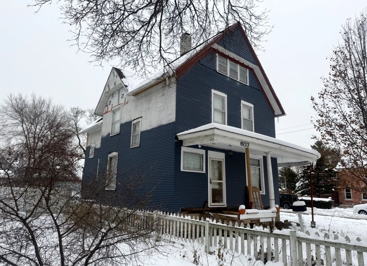 603 Douglas Avenue Elgin, IL 60120 - Photo 5 of 6 a front view of a house with a yard