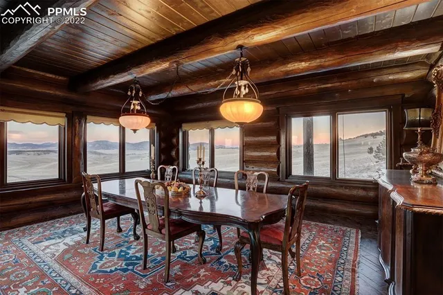 a view of a balcony with wooden floor and fence