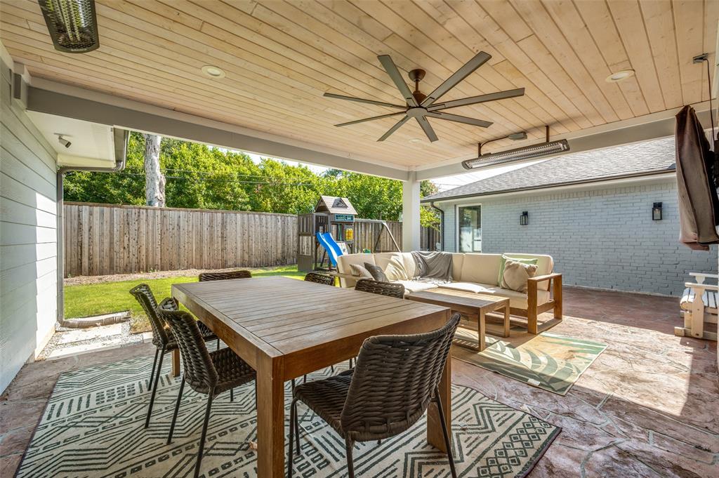 3619 Merrell Road Dallas, TX 75229 - Photo 24 of 26 Spacious covered patio featuring a wood-finish plank ceiling with recessed lighting and a large ceiling fan