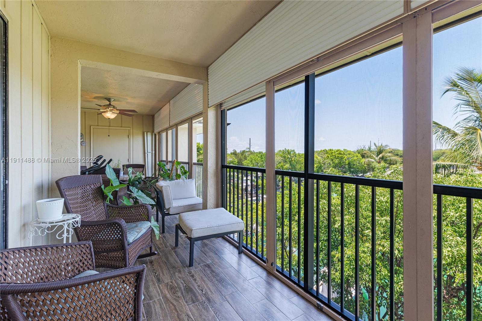 96000 Overseas Highway, Unit W44 Key Largo, FL 33037 - Photo 11 of 33 a balcony with furniture and wooden floor