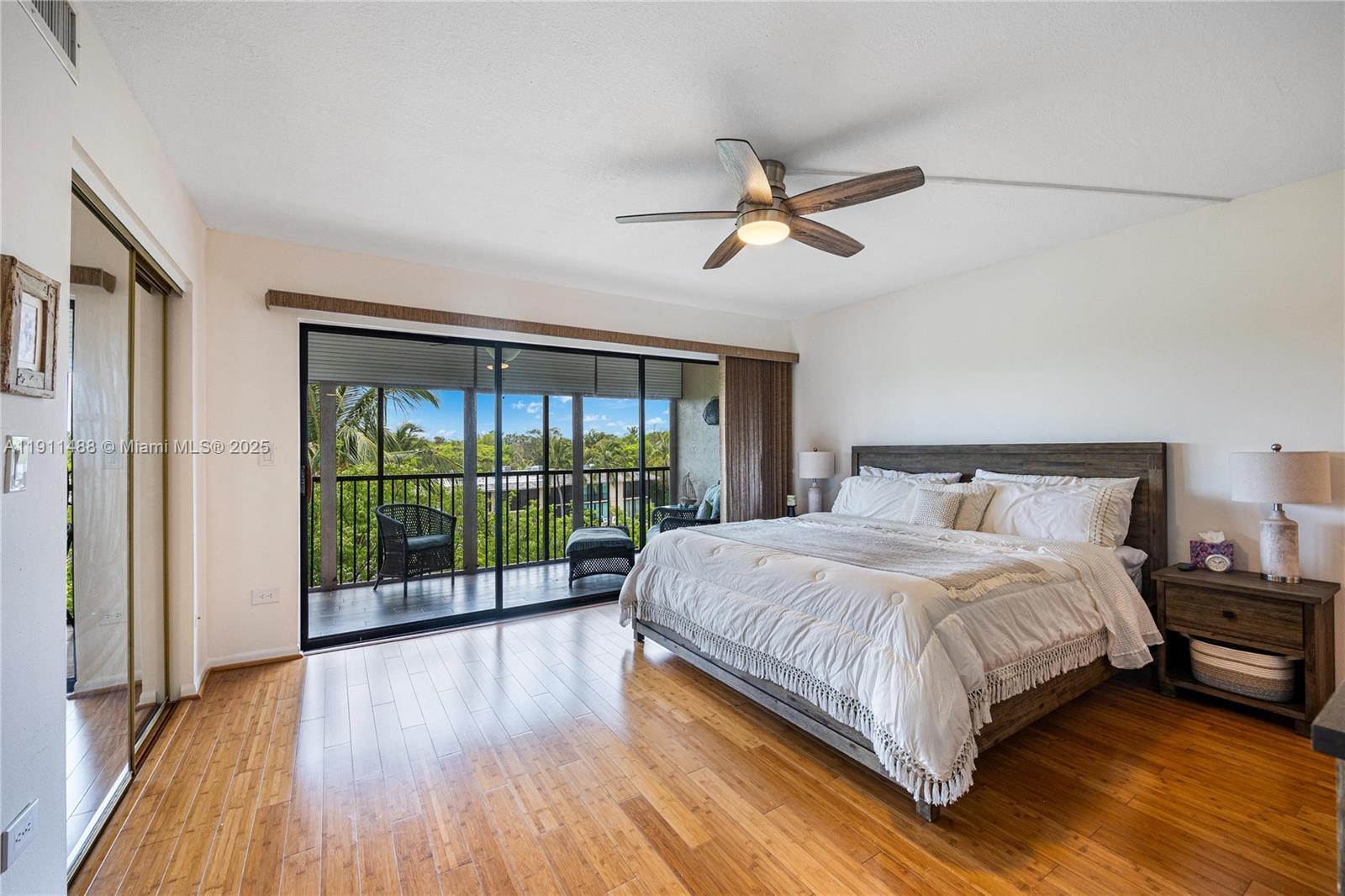 96000 Overseas Highway, Unit W44 Key Largo, FL 33037 - Photo 16 of 33 a bedroom with a large bed and a large window