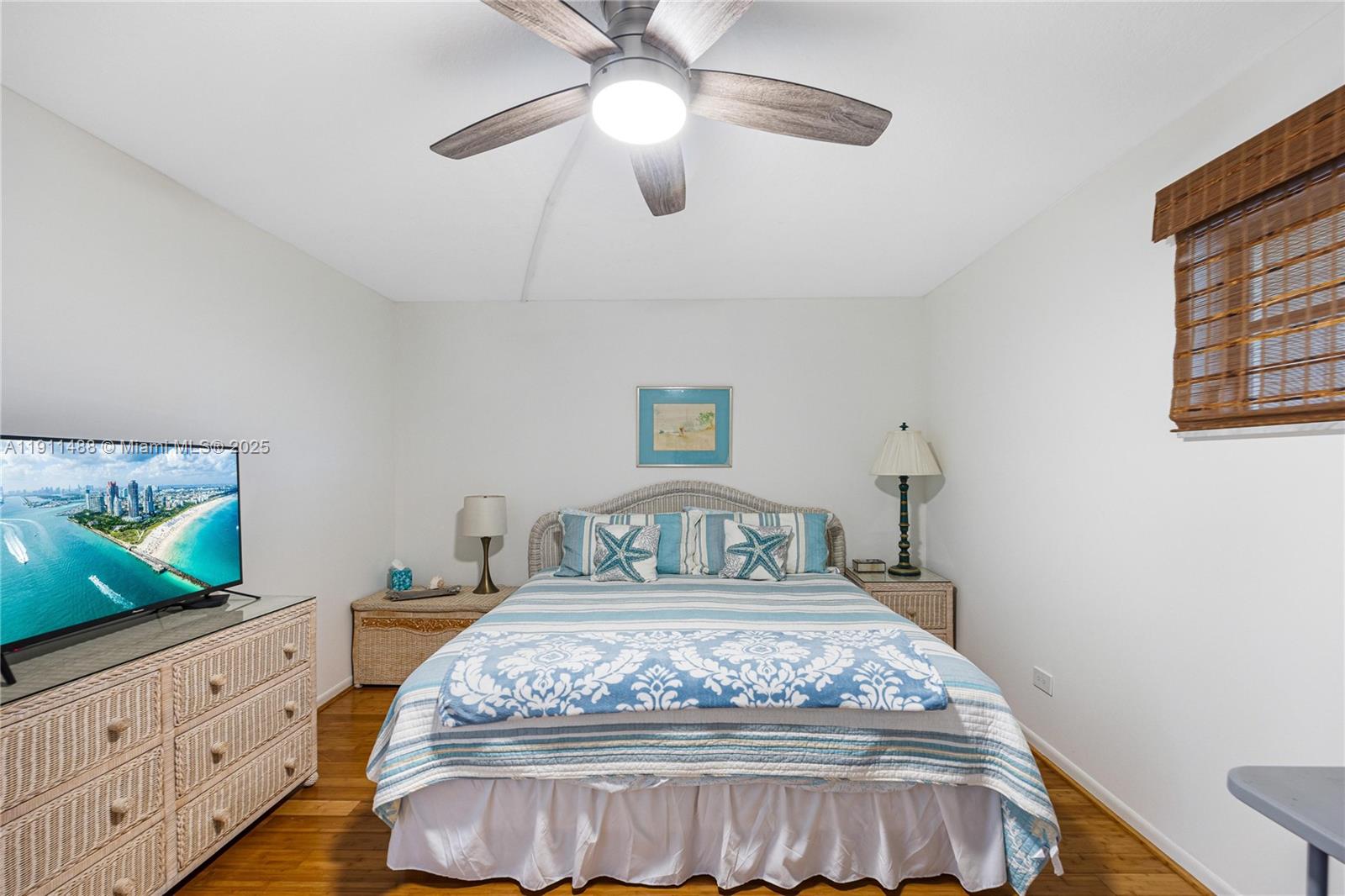 96000 Overseas Highway, Unit W44 Key Largo, FL 33037 - Photo 19 of 33 a bedroom with a bed and a flat screen tv