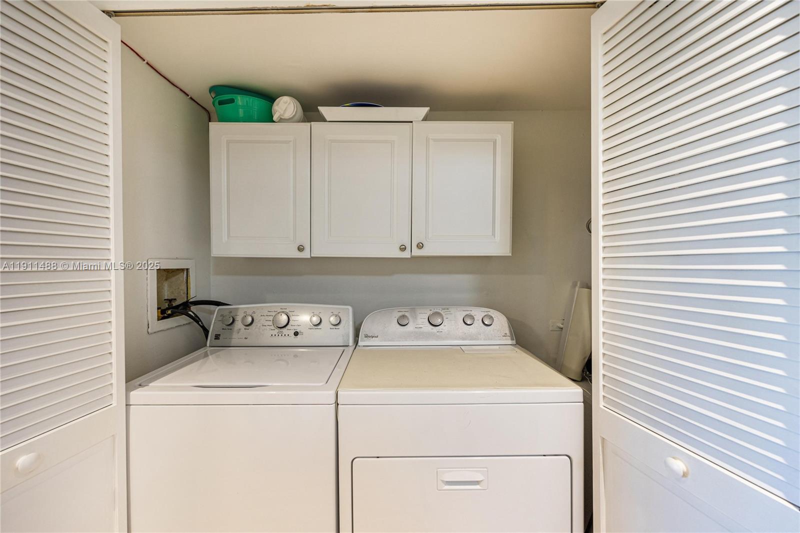 96000 Overseas Highway, Unit W44 Key Largo, FL 33037 - Photo 22 of 33 a utility room with dryer and washer