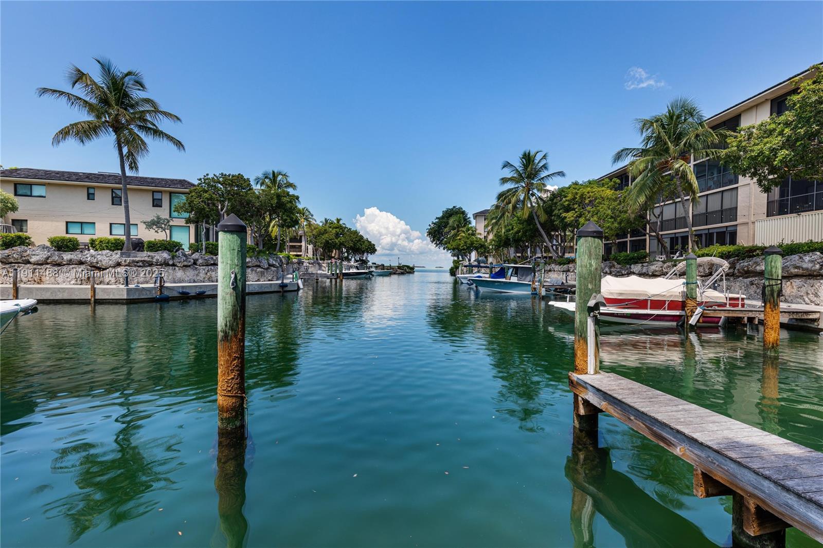 96000 Overseas Highway, Unit W44 Key Largo, FL 33037 - Photo 24 of 33 a view of residential house with outdoor space and lake view