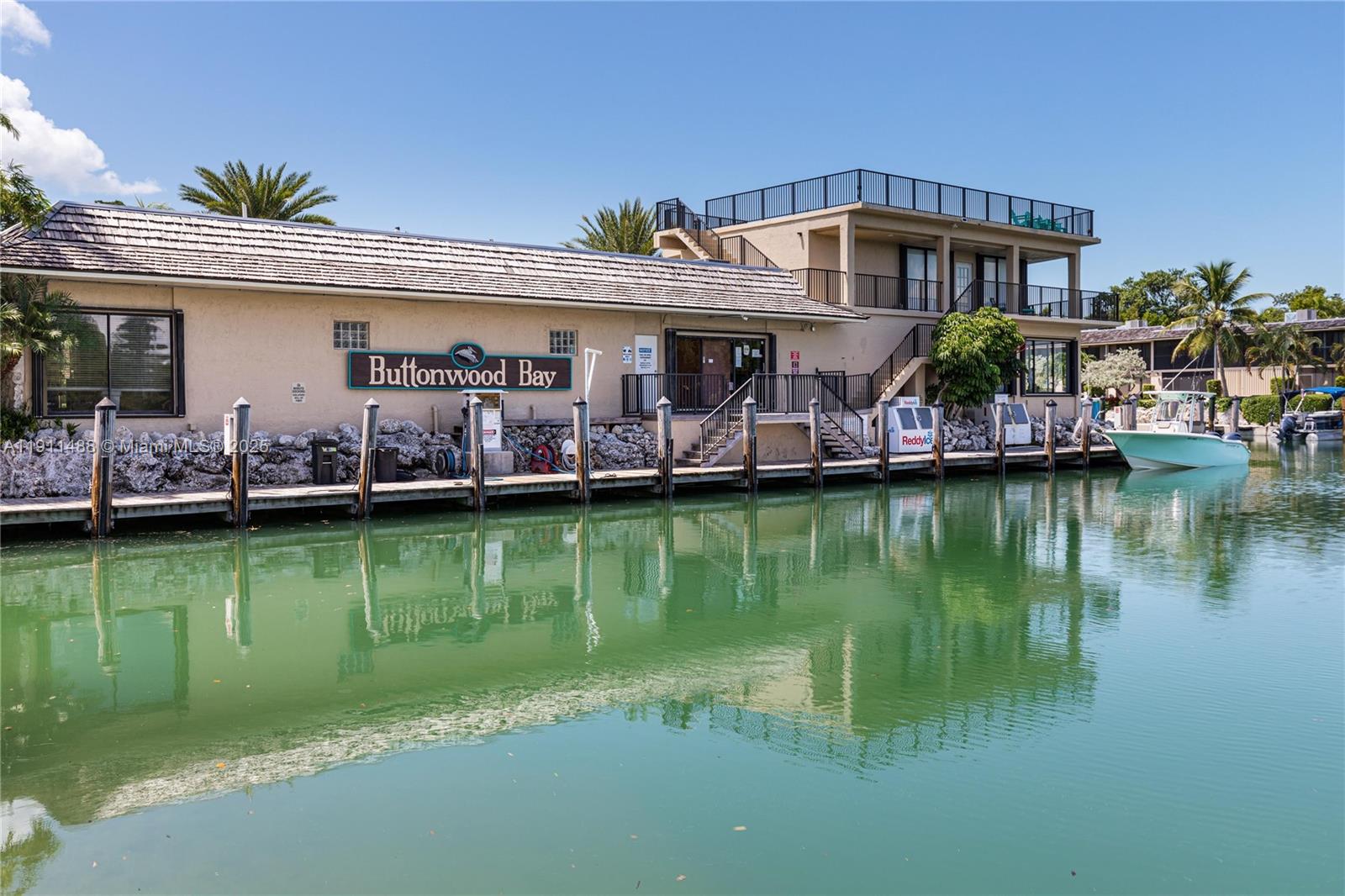 96000 Overseas Highway, Unit W44 Key Largo, FL 33037 - Photo 25 of 33 a front view of a house with a boat