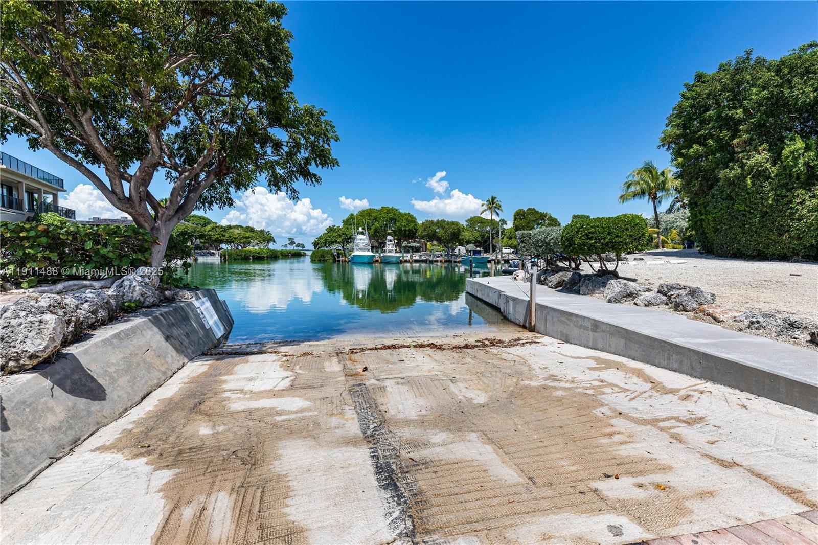 96000 Overseas Highway, Unit W44 Key Largo, FL 33037 - Photo 27 of 33 a view of a backyard with a patio