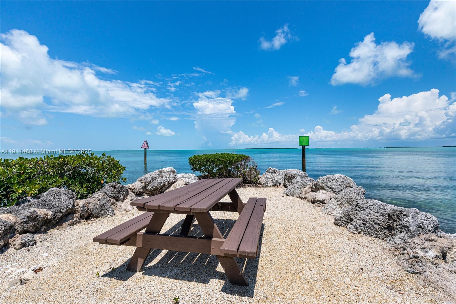 96000 Overseas Highway, Unit W44 Key Largo, FL 33037 - Photo 29 of 33 a view of a backyard with furniture
