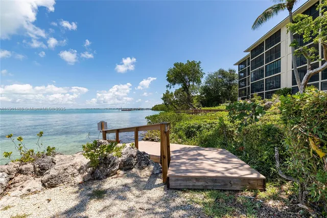 a view of a garden with an outdoor seating