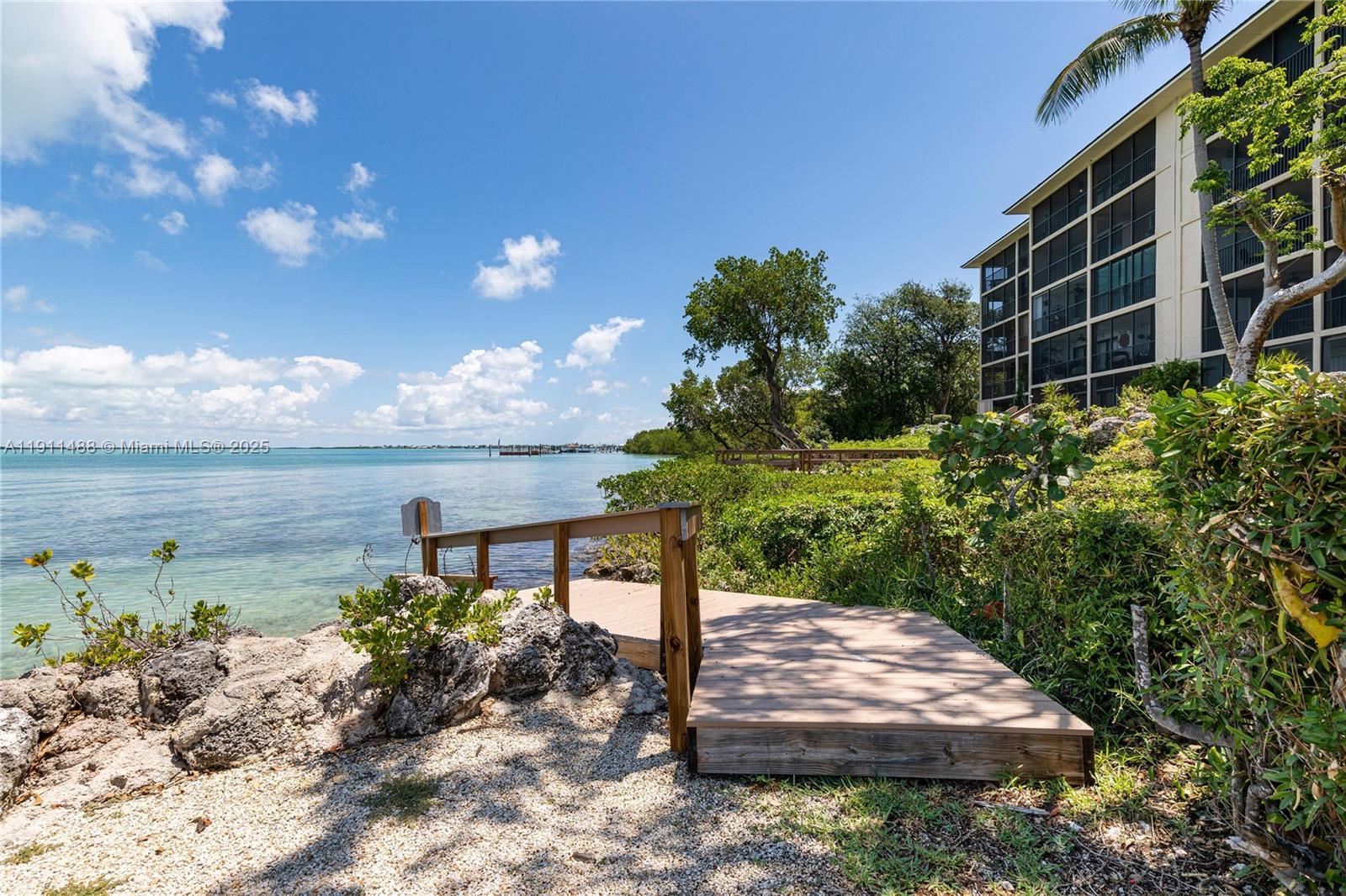96000 Overseas Highway, Unit W44 Key Largo, FL 33037 - Photo 30 of 33 a view of a garden with an outdoor seating