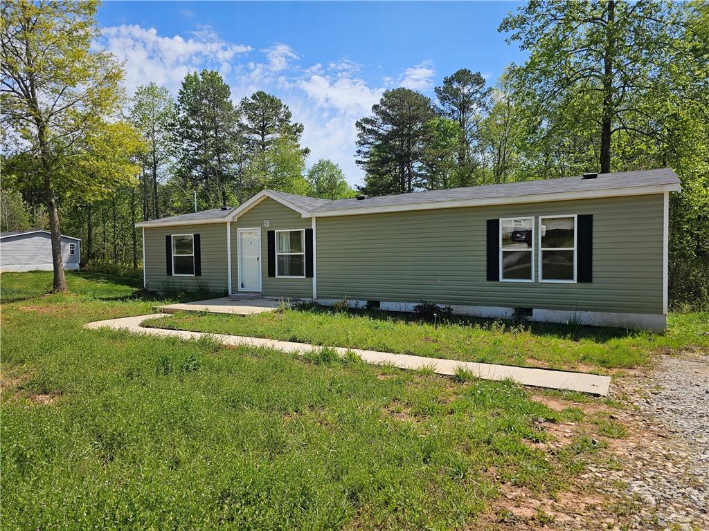 241 Southgate Road Alto, GA 30510 - Photo 1 of 1 a front view of house with yard and green space