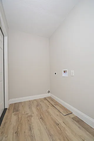 an empty room with wooden floor