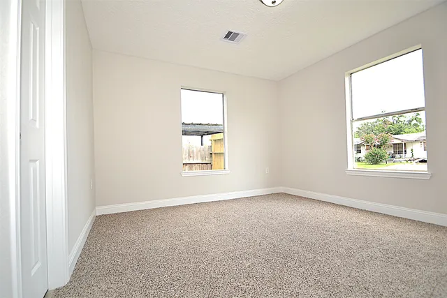 an empty room with windows