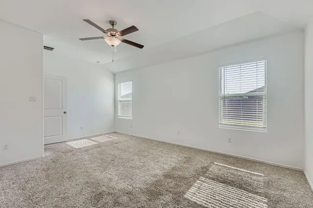 a view of an empty room with a window