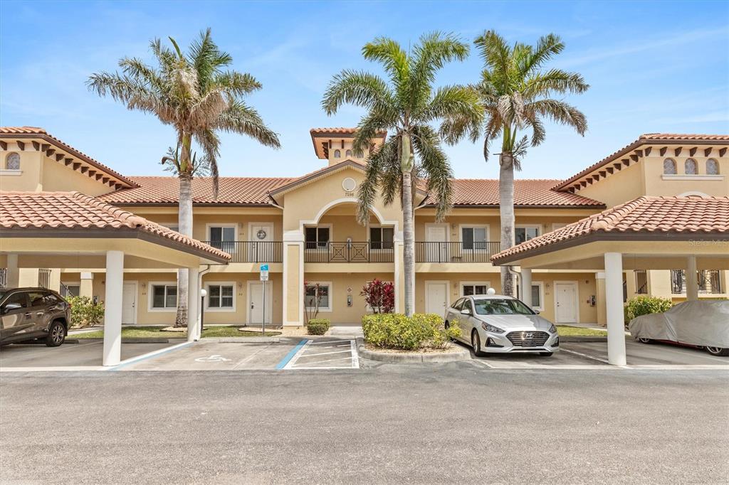 7196 North Plum Tree, Unit 323 Punta Gorda, FL 33955 - Photo 1 of 44 a car parked in front of a white house