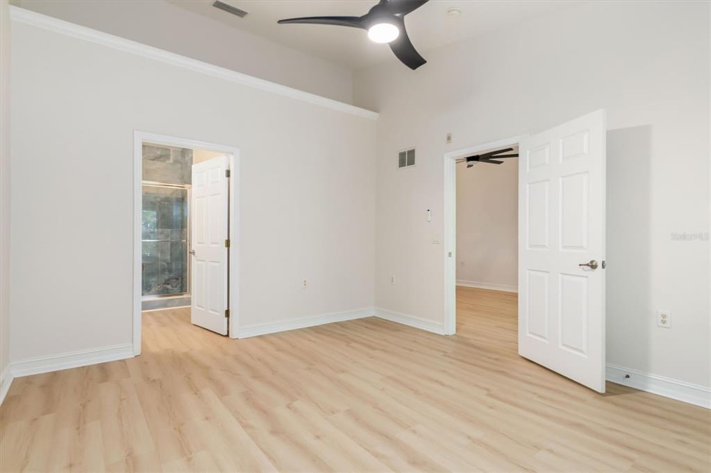 7196 North Plum Tree, Unit 323 Punta Gorda, FL 33955 - Photo 19 of 44 an empty room with wooden floor closet and windows