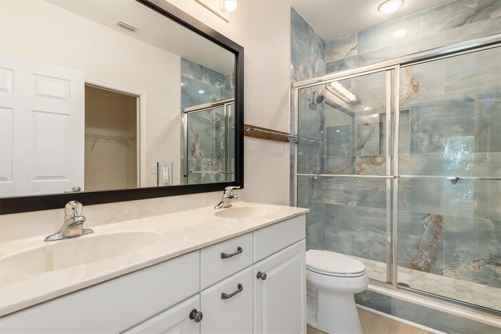 7196 North Plum Tree, Unit 323 Punta Gorda, FL 33955 - Photo 20 of 44 a bathroom with a sink toilet and shower