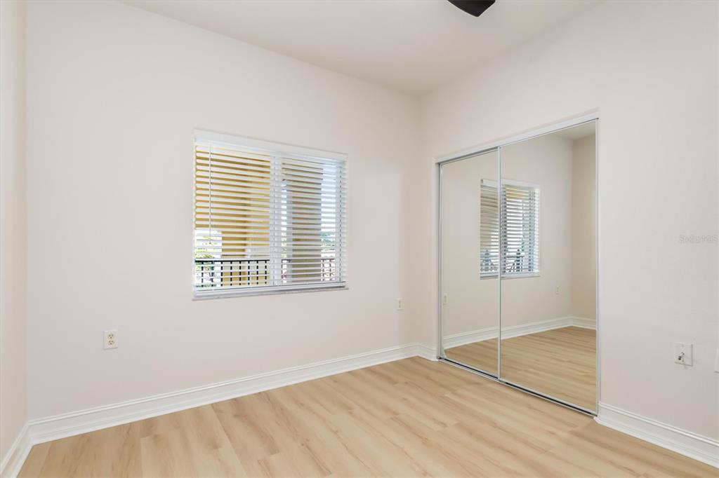 7196 North Plum Tree, Unit 323 Punta Gorda, FL 33955 - Photo 24 of 44 a view of an empty room with wooden floor and a window