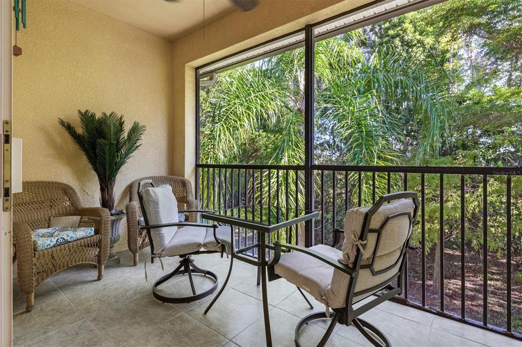 7196 North Plum Tree, Unit 323 Punta Gorda, FL 33955 - Photo 28 of 44 a view of a balcony with chairs and a swing
