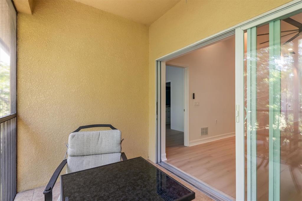 7196 North Plum Tree, Unit 323 Punta Gorda, FL 33955 - Photo 29 of 44 a hallway with sliding door and wooden floor