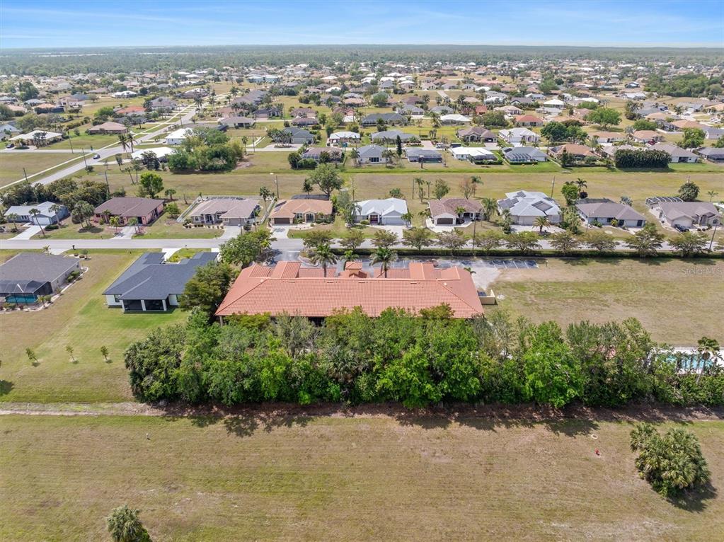 7196 North Plum Tree, Unit 323 Punta Gorda, FL 33955 - Photo 35 of 44 an aerial view of a city with lots of residential buildings lake and ocean view