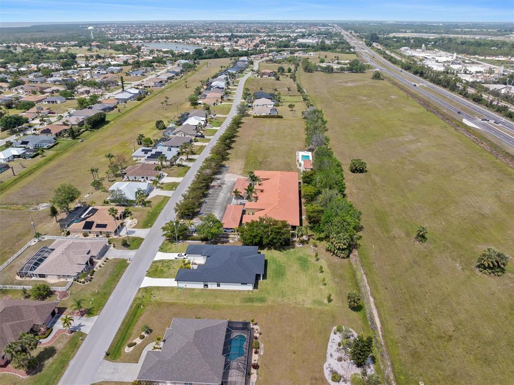 7196 North Plum Tree, Unit 323 Punta Gorda, FL 33955 - Photo 37 of 44 an aerial view of residential houses with outdoor space