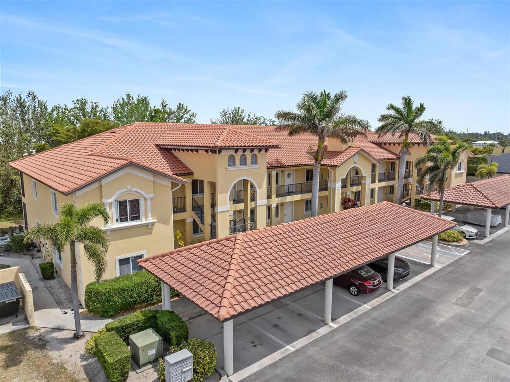 7196 North Plum Tree, Unit 323 Punta Gorda, FL 33955 - Photo 39 of 44 a aerial view of a house with a yard and potted plants