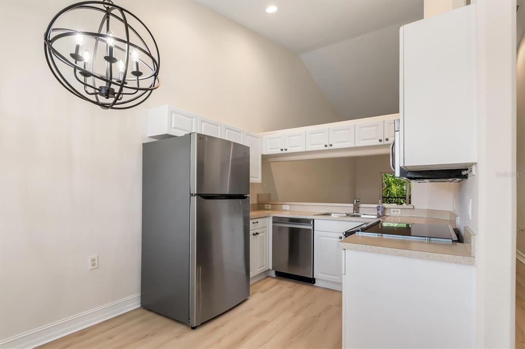7196 North Plum Tree, Unit 323 Punta Gorda, FL 33955 - Photo 4 of 44 a kitchen with a refrigerator and a stove