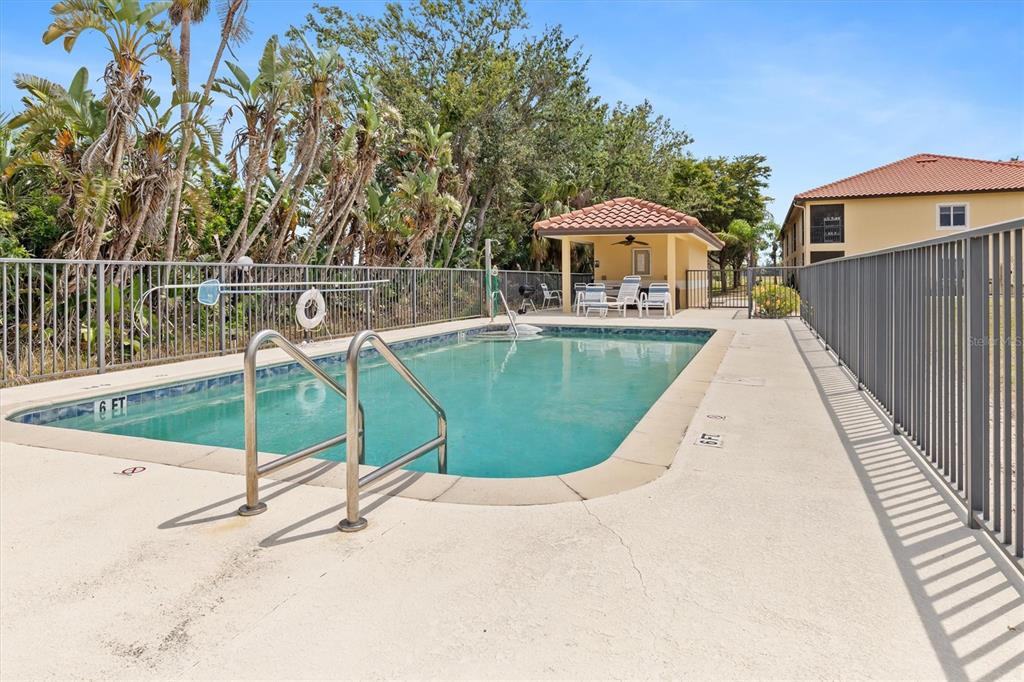 7196 North Plum Tree, Unit 323 Punta Gorda, FL 33955 - Photo 42 of 44 a view of a swimming pool with a lounge chairs
