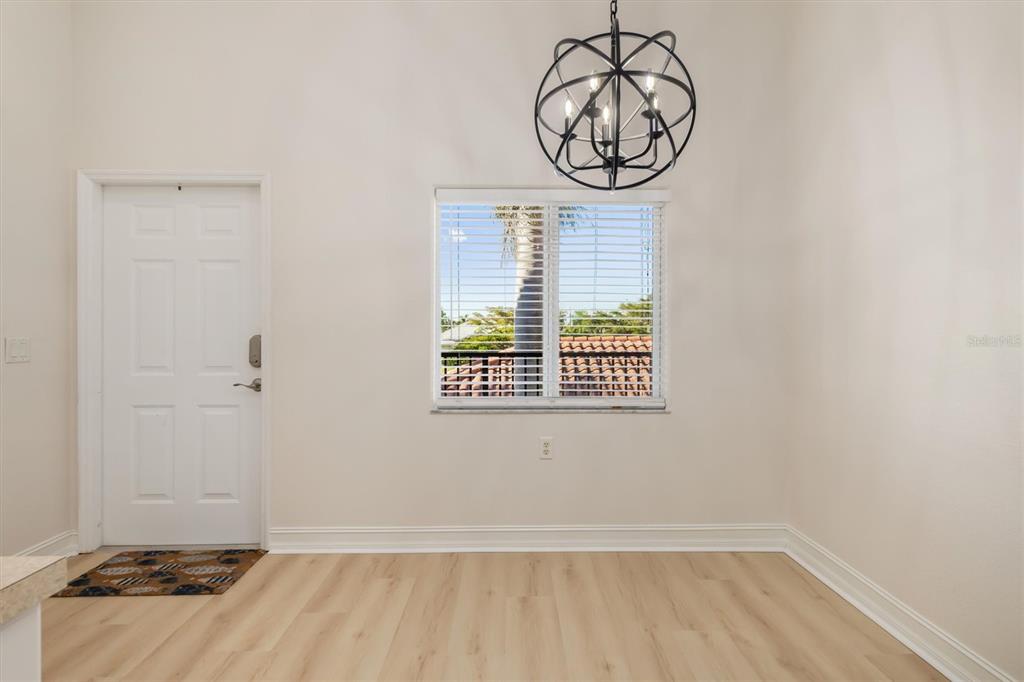7196 North Plum Tree, Unit 323 Punta Gorda, FL 33955 - Photo 7 of 44 a view of a room with wooden floor and windows