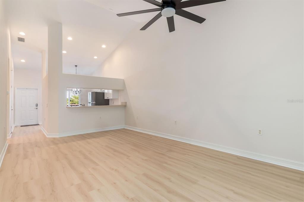 7196 North Plum Tree, Unit 323 Punta Gorda, FL 33955 - Photo 9 of 44 wooden floor in an empty room with a window