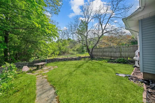 a backyard of a house with lots of green space