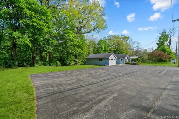 a view of outdoor space with garden and trees