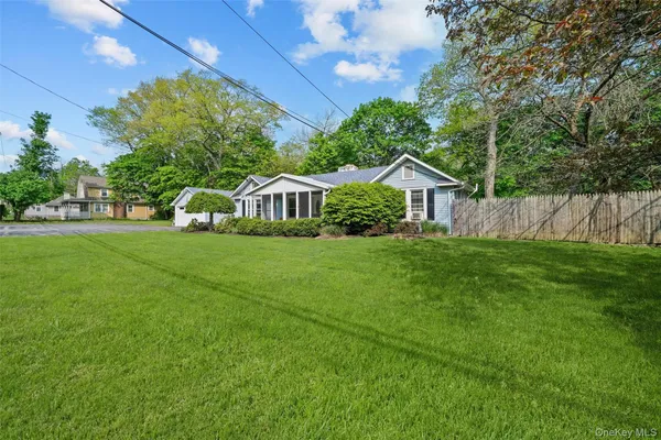 a view of front of house with a yard
