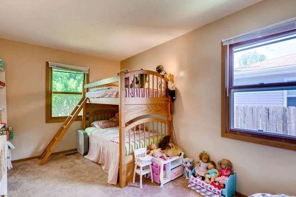 21301 West Willow Road Lake Zurich, IL 60047 - Photo 11 of 14 a bedroom with two beds and a window