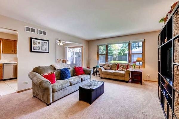 21301 West Willow Road Lake Zurich, IL 60047 - Photo 4 of 14 a living room with furniture and a flat screen tv